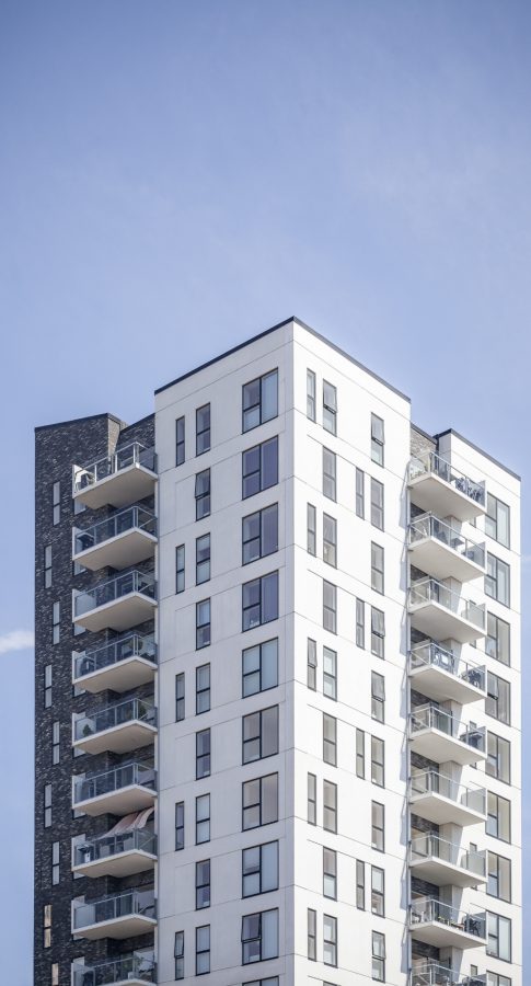 vertical-shot-white-building-clear-sky